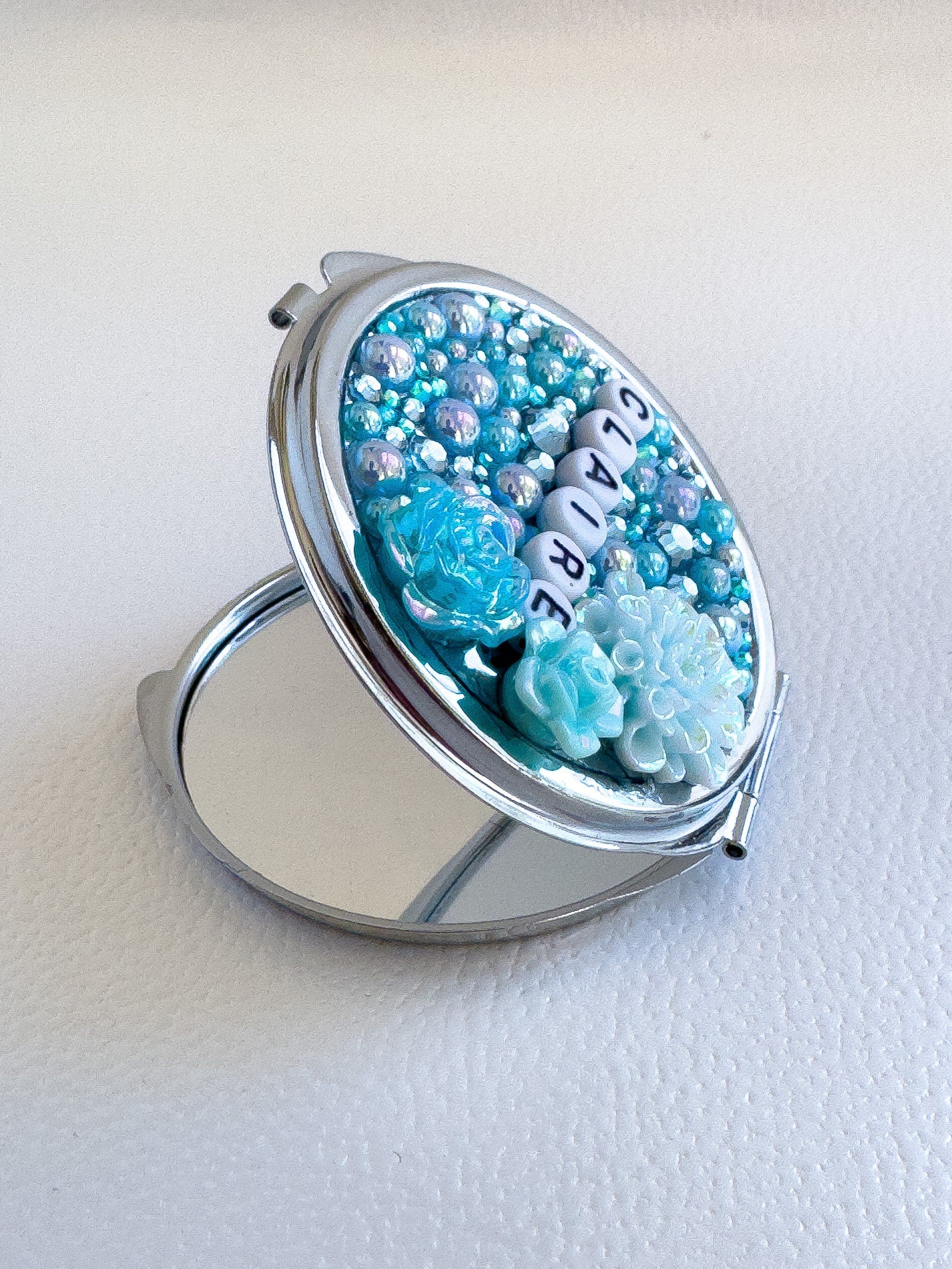 a ring with a picture of flowers on it