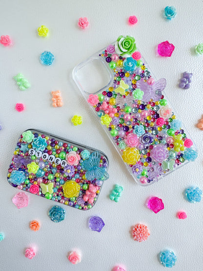 a cell phone case sitting next to a case filled with colorful beads