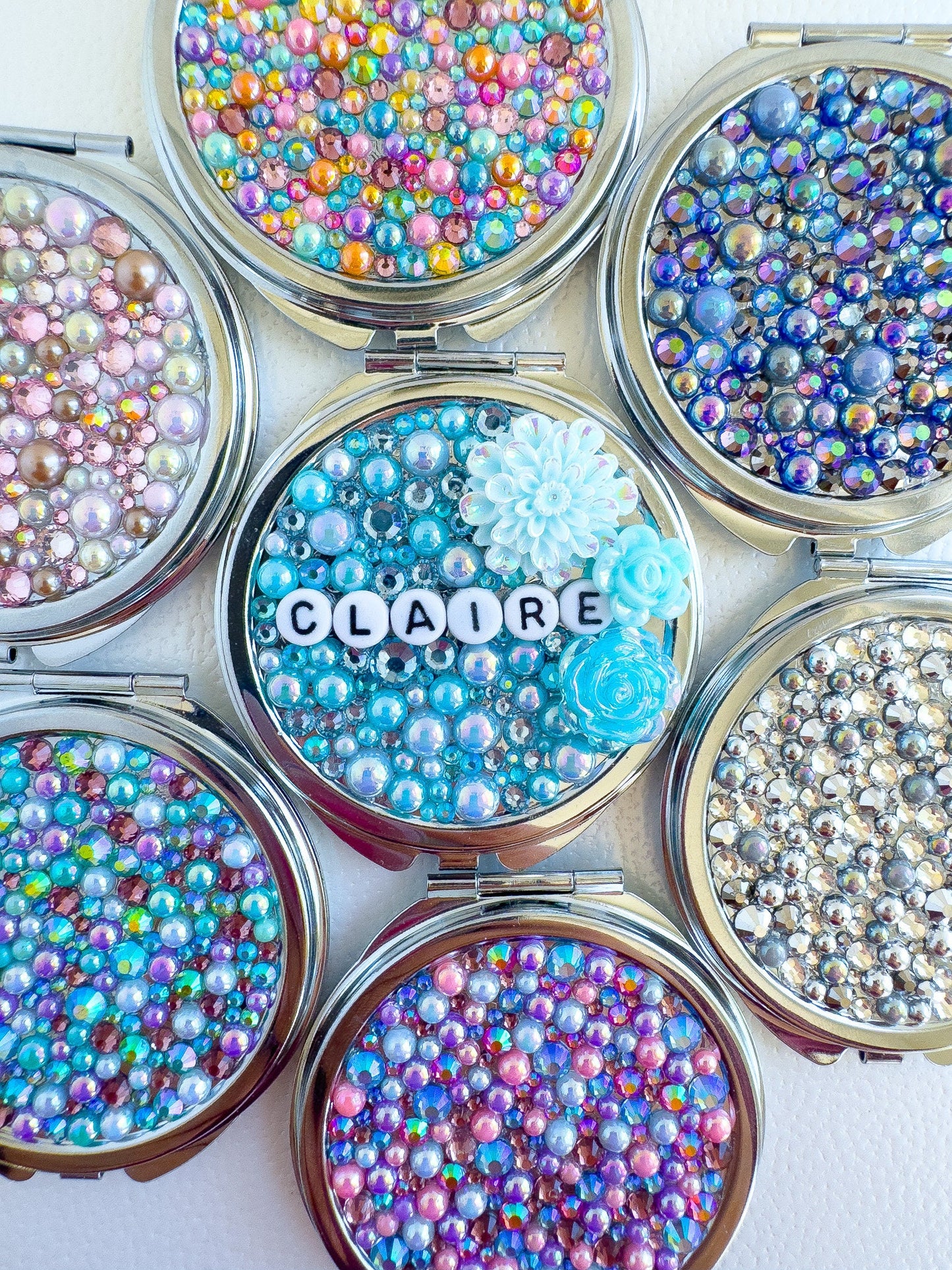 a close up of a group of small containers filled with beads