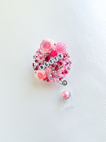 a brooch with beads and flowers on it