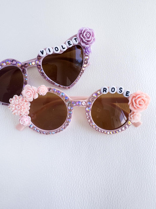 a pair of sunglasses with flowers on them