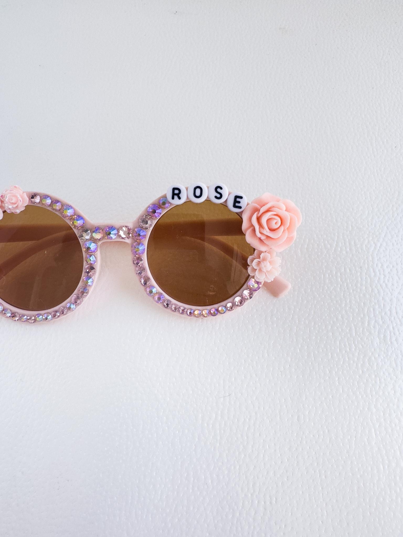 a pair of sunglasses with flowers on them